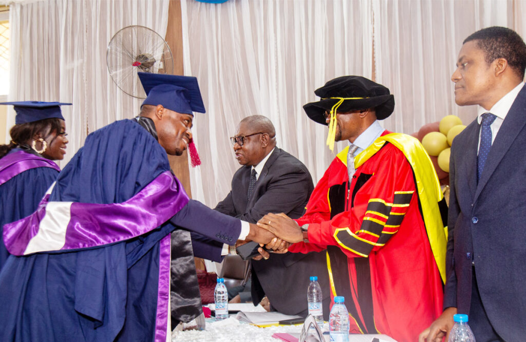 President /CEO Dr Jude Chilaka congratulates graduating student