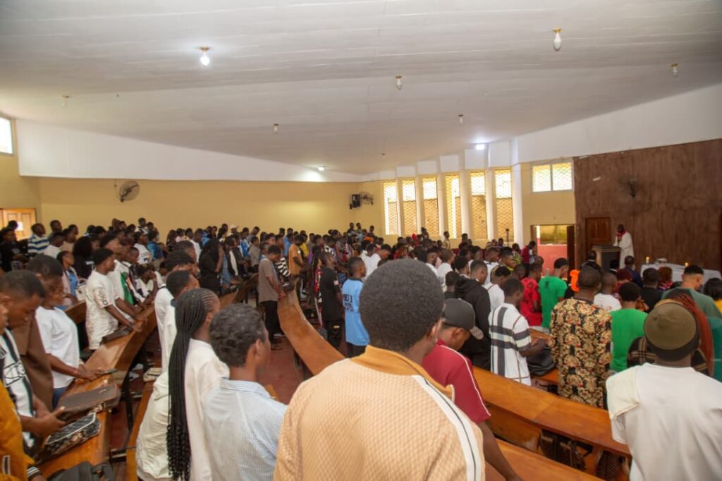 Cross section of first year students during opening Mass on campus