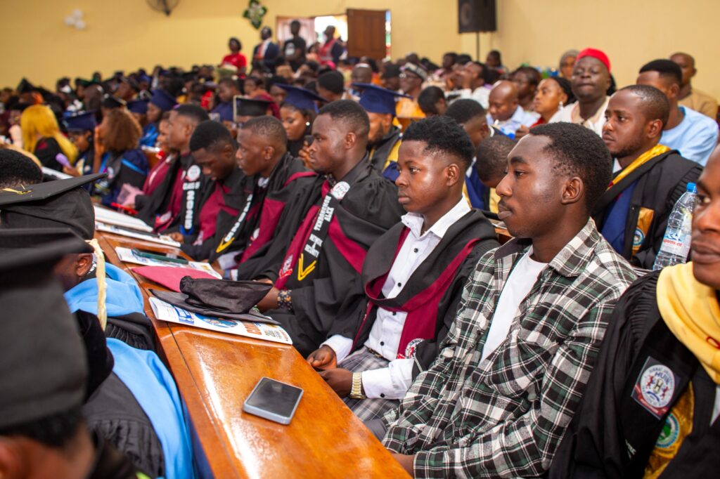 Graduating students listening to keynote discourse