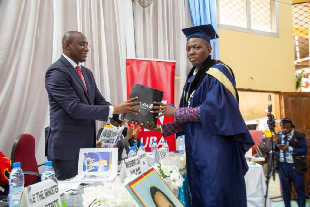 UBA boss hands prize to graduating student